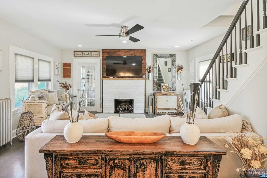 Welcome to this beautiful and stylish Colonial home that has undergone a renovation to update its design and features. This property offers brand-new hardwood flooring, a patio, a large deck, a sunroom/den, a full basement, 2 car garage, and a shed. The basement has a laundry area, storage, and a full bath. The property is near mass transportation (bus and train) and easy highway access. The primary bedroom offers a huge walk-in closet. Come see this home today on this gorgeous tree-lined street. We invite you to see this home. The roof is only 2 years old, the boiler was installed in 2019. The fireplace was installed in 2019. The 2 car garage is brand new as well. The stairs and the patio is being sold AS-IS.