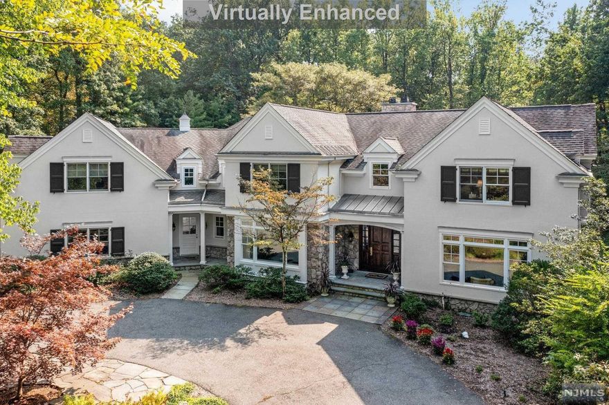 Quality, location, privacy, class and amenities, this property has it all. Set on a one of a kind flat private acre lot w/reflecting pond & lush grounds. Exquisite Country French Colonial, designed by the illustrious architect, James Paragano. Impressive younger construction boasting 6,000+ sqft of interior space. 1st floor features dramatic double story entry & spiral staircase; elegant LR; amazing family room w/FPL; banquet dining room; sparkling gourmet kitchen w/intimate breakfast area & butler's pantry; library; mud room; 2 powder rooms. 6 BR on second floor. Primary suite w/FPL & luxurious spa/BTH; BR,BR,FBTH, BR BR FBTH, laundry. Huge walkout 9' high basement w/gym; rec room; BR/FBTH; powder room. 3 car attached & heated garage. Magnificent back property, perfect for a future heated in-ground pool! A sweet escape to paradise! A must see!