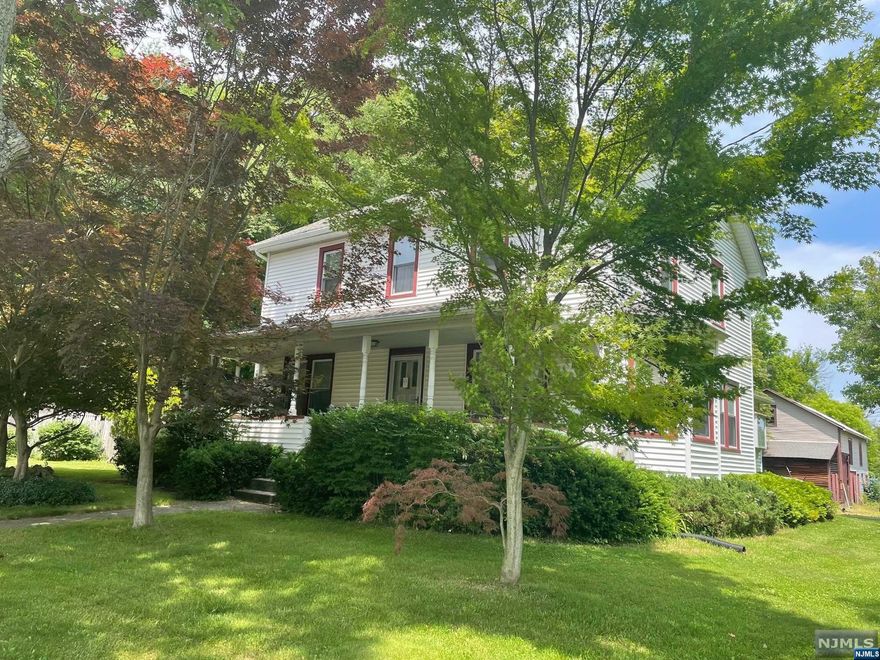 This offering is a rare opportunity to find 2 homes plus a barn offered for sale on 7.42 acres in beautiful Allamuchy Township. Minutes to Route 80, the main house is a 1930's Farmhouse Colonial with an expansive Front Porch, Original Center Hall Staircase, Country Kitchen with Pantry & Sliders to Deck, Mud Room, 2 full Baths, 3 Bedrooms and a large partially finished walkup Attic. The Family Room has a full wall brick wood burning fireplace with a second brick fireplace located on the 2nd floor in the spacious primary bedroom with walk in closet. Some wood floors are located throughout with a lot of closets and storage space. Vintage accents include claw foot bath tub, stained glass window, some door hardware, hidden cabinet folding Ironing board and 15 lite pocket doors. Walk out unfinished Basement.