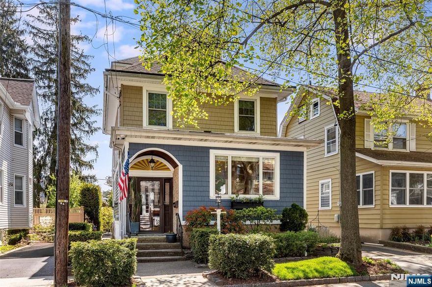 On a tree-lined street, just minutes from the Glen Ridge train station, sits this lovely four-bedroom home with one full bath and two half baths. Close to the shops and restaurants along Broad Street and just a short drive to vibrant downtown Montclair, this home offers easy access to the city and the ease of suburban living. Inside, the spacious living room flows into a large dining room with a fireplace, perfect for casual dinners, hosting holidays, and everything in between. The renovated kitchen features quartz countertops, new tile, new cabinetry, and plenty of space to try new recipes with friends. The updated first-floor powder room adds everyday convenience. Central air keeps things cool and comfortable. The second floor includes three bedrooms and a hall bath with a tub, while the third floor offers a fourth bedroom ideal for guests or work-from-home space. The full basement includes an additional half bath, a large laundry room, and plenty of room for a playroom, media room, gym, or hangout space. Large French doors off the dining room open to a deck, providing a perfect spot for al fresco dining or simply listening to the birds chirp on a lazy summer night. A large grassy yard and custom planting bed provide the perfect spot for the dog to run free and to finally start the garden of your dreams. Park your car in the garage or use it to stash your gear!