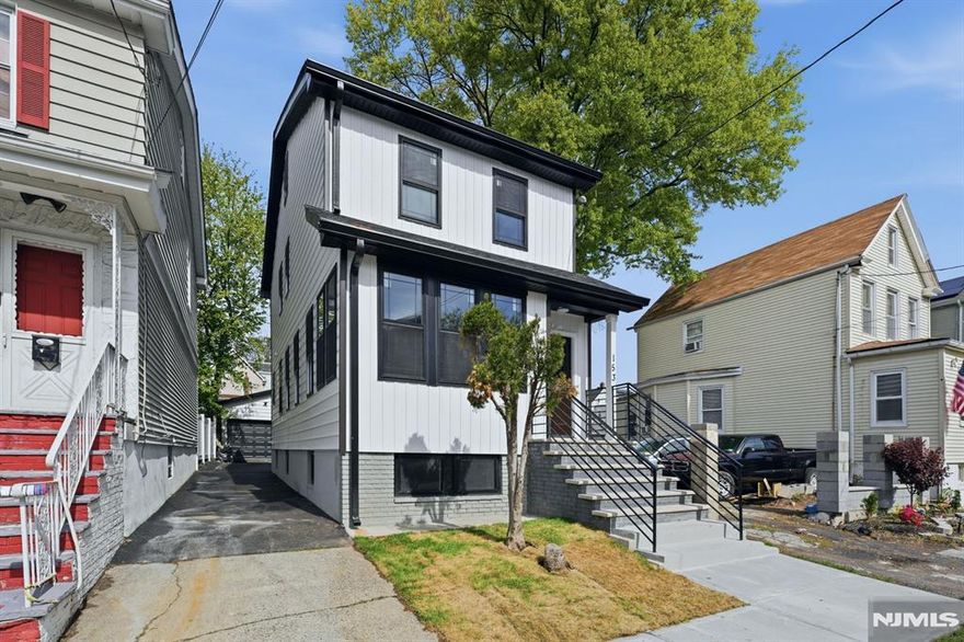 Stunning top notch modern single-family home offering 4 spacious bedrooms and 2.1 bathrooms, plus a finished attic and a fully finished basement. The first floor features a bright formal living room, an elegant dining area and a Beautifully designed kitchen featuring a center island with a built-in microwave space conveniently tucked underneath. sleek finishes and brand-new stainless steel appliances, along with direct access to a rear cozy deck. A convenient powder room and an enclosed front porch provide ideal space for a home office, sitting area, or flexible use. The second floor along with the finished attic offers four generously sized bedrooms and a full bathroom, providing comfort and versatility. The finished basement showcases an open-concept layout, a full bathroom and a dedicated laundry area. This home is equipped with dual-zone central air and HVAC systems for efficient year-round comfort. The exterior features a private driveway, an oversized detached garage and a cozy deck ideal for entertaining and outdoor gatherings. Truly turn-key and move-in ready, conveniently located near NYC transportation, schools, shopping and more. A must-see home that offers the perfect blend of style, space, and functionality!