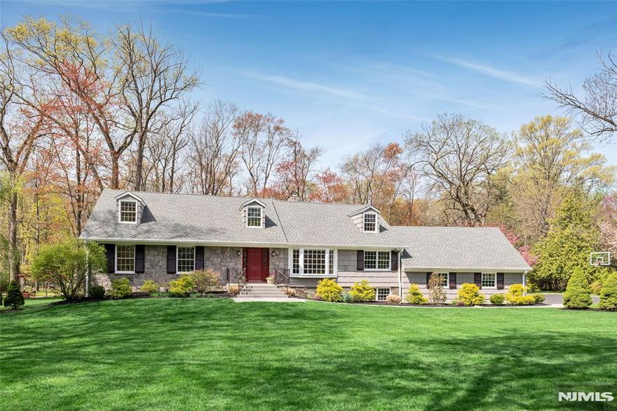 Discover your dream home nestled on a beautiful 1-acre property, featuring 6 bedrooms and 4.5 bathrooms. Step into the inviting living room that leads into a bright dining room with oversized glass doors and a bay window. The main floor includes a well-equipped eat-in kitchen, a convenient powder room, and a primary bedroom with a walk-in closet and ensuite bath. The office/den is a cozy haven with custom built-ins, a fireplace, and leaded glass windows, offering direct access to the expansive yard. A unique back staircase leads to a private guest suite or au pair living space and the upper floor accommodates four spacious bedrooms, two hall baths, and ample storage. Enjoy the versatility of a partially finished basement, complete with a fireplace and access to a beautiful brick patio, perfect for outdoor entertaining. A large 3-car garage enhances the homeâ€™s functionality, while charming curb appeal welcomes you home. Donâ€™t miss the chance to own this exceptional property!