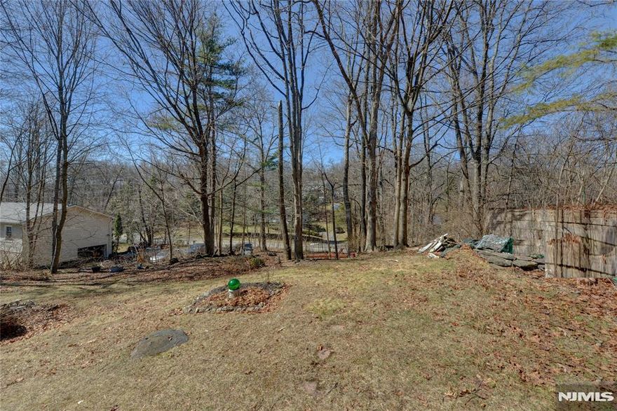 Welcome to this charming 3 bedroom, 1-1/2 bath home nestled in the desirable Highland Lakes community. Step into the inviting living room featuring a striking stone fireplace, skylights, and a cozy loft that adds both character and versatility. The layout flows to a spacious deck, perfect for entertaining or relaxing while overlooking the large backyard. Set in a vibrant community with access to five beautiful lakes and a wealth of amenities, this home feels like you're vacationing all the time. Whether you're enjoying peaceful evenings by the fire or taking advantage of the outdoor recreation nearby, this property offers a lifestyle you'll love year-round. With basketball courts and lake within 2 blocks. Terrific access to all amenities that membership offers.