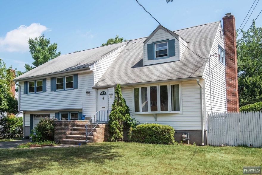 This home has it all! Great location on a dead-end street. Four bedrooms, two-and-a-half baths, modern kitchen and bathrooms, hardwood floors throughout, full finished basement, garage, driveway, and backyard. Very convenient to schools, shopping, and public transportation.