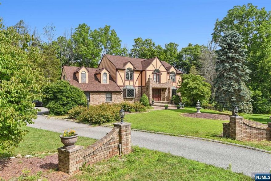 Tucked away in desirable Storm Estates at the end of a peaceful cul-de-sac, this custom-designed 4 bed, 4.5 bath home offers elegant living with modern amenities. The grand entrance features a spacious foyer with hardwood flooring and abundant natural light. The first floor includes a formal living room, dining room with intricate molding, and a gourmet eat-in kitchen with cherry cabinets, center island, double wall ovens, and a pantry. The great room has a wood-burning fireplace. Additional spaces include a TV/office room, full bathroom, laundry room, and a guest bedroom with an en-suite bath. Upstairs, the primary suite has a dressing area, walk-in closets, and an ensuite bath. Three more bedrooms and a full bathroom complete the second level. The finished basement offers a recreation area, gym, playroom, workshop, storage, and a wine cellar. An attached 2-car garage provides extra storage. Features include multi-zone central air, an above-ground Roth oil tank, and a new roof.