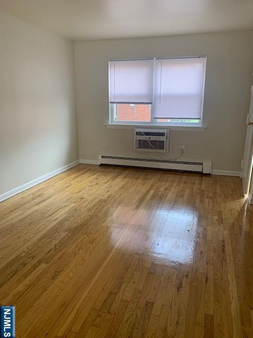 Studio Apartment - Living Room, Kitchen & Bath. Freshly Painted, hardwood flooring. Refrigerator included