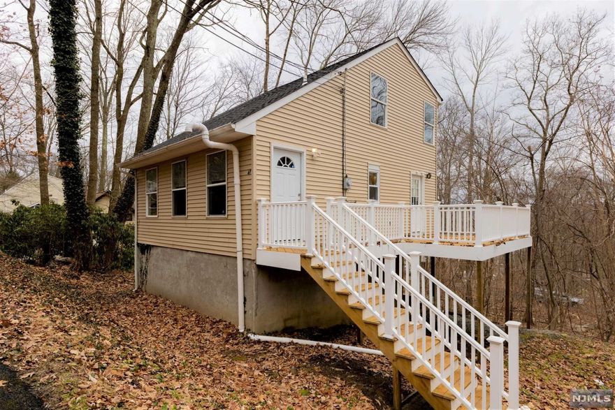 Just one look will do! This Charming Cozy Lake home was renovated in 2018! Gorgeous eat-in kitchen with granite counters, stainless appliances, tile backsplash, modern range hood. Spacious and bright living room with beautiful floors, recessed lighting. Family Room and full bath in walk-out basement. Large main bedroom with walk-in closet, plus second closet. Bonus room for office/den/mud room. Huge deck overlooking yard and woodlands. Private location! Last house on a dead end street. Renovated 2018. Furnace 2018. Septic 2019, HWH 2022, Well Tank 2022. Natural gas in street. Cozy Lake membership not mandatory offers beach, swimming. Sold as is. Close to Route 23. Great condo alternative. Move Right-In!