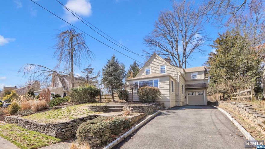 Welcome home to this lovely Nantucket Colonial That has been beautifully updated with all of todays modern conveniences for todays lifestyle while still keeping with the grace & charm of yesteryear. This home has a newer kitchen within the past 5 years w/Stainless steel Thermador & Kitchen Aide appliances including warming drawer & newer wood flooring,The French doors in the kitchen lead to an awning covered deck overlooking a beautiful fenced yard. The gracious living room with a wood burning fireplace & beautiful wood flooring. Just beyond the living room is a sun-filled sunroom overlooking the front lawn of this gracious home. The second floor w/3 well size bedrooms have closets & cubbies a plenty. Plus 2 full updated bathrooms! Additionally a full finished basement with rec. room plus a gorgeous stone fireplace!Hurry to see this lovely home today!! Newer roof 15 yrs,6 zone irrigation System & newer gas steam furnace approx.10yrs. ago. This home shows true Pride of ownership!