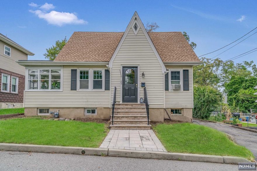 Welcome home to this well-maintained 4 bedroom, 2 full bath home, located at the end of a quiet cul-de-sac. Lovely curb appeal at this charming Cape, with new front steps, and classical yet updated design features to fit the needs of today's modern buyer. First floor is spacious and bright with hardwood floors throughout featuring a living room, sunroom, large eat-in kitchen filled with natural light, a center island, and formal space for dining with sliding doors to rear deck. Two generously sized bedrooms, and a full bath on first level and master bedroom, full bath, and an additional bedroom on second level. Ground level access to finished basement that is perfect as an additional living space or playroom. Detached two-car garage and fantastic rear yard that is perfect for entertaining with an expansive deck. Located just moments from Oldham Pond, Hofstra Park, and 20 miles from New York City.