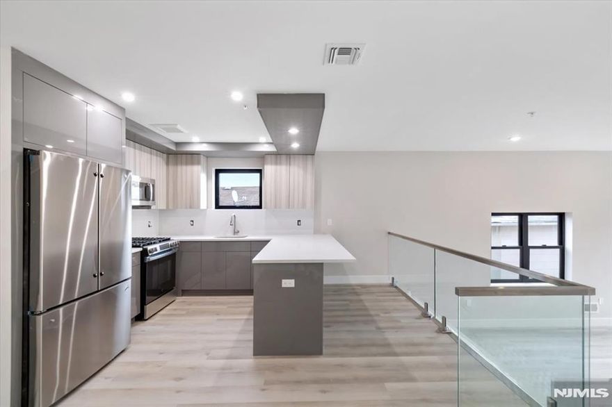 One Month Free on 18+ Lease. Be the first one to enjoy this beautiful new construction unit offering Shared Backyard and 2 Private Parking spaces. Open your entry door to this modern apartment featuring 2 bedrooms, 2 bathrooms, open concept living space with LED electric fireplace, wrap around windows that flood the area with natural light. The unit is directly southeast facing. The chefâ€™s kitchen features white high-gloss European Style cabinetry, stainless steel premium appliances, modern backsplash, central island with plenty of room on the counter space. This unit offers a relaxing spaâ€“like bathroom with silver hardware and luxurious vanity. Other perks include big washer and dryer in unit, central/heat/air, and Intercom System. NYC transportation, restaurants and shops at your fingertips.