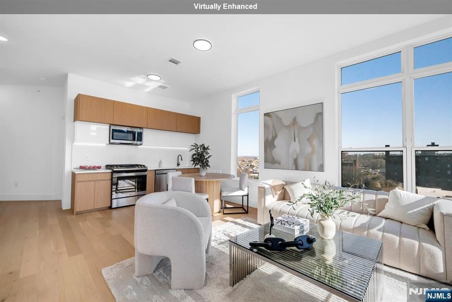 Exclusive Offer: Penthouse Unit with Seller-Paid Closing Costs! Introducing Tailor House at 38, Hudson County's newest luxury condominium building. With just 48 residences, this boutique elevator building offers privacy, style, and convenience, only 15 min from NYC by bus. Tailor House at 38 redefines modern living with oversized 1 & 2 bedroom homes featuring open layouts, soaring 9-10 ft ceilings, & spacious bedrooms. Kitchens are equipped with waterfall quartz countertops, sleek islands in select units, European style two-tone oak cabinetry & GE Professional Series appliances. Bathrooms offer floor-to-ceiling porcelain tiles, glass-enclosed showers, and marble-top vanities, creating a spa-like atmosphere. Amenities include a fitness center, luxury lobby, garden terrace, & smart security with Swiftlane intercoms. Assigned parking is included, with extra spaces available for purchase. Plus, enjoy the added benefit of a 5-year tax abatement. Discover a lifestyle of luxury and convenience nestled in the heart of historic Union City.