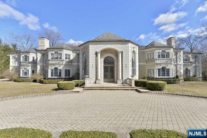 This approximately 20,000 sf residence was custom built for the original owner on approximately 4 lush acres. Hard coat European stucco exterior with stone enhancements and slate roof. Some of the unique features: award winning Theo Kalomirakis theater, a spectacular wine cellar and tasting room, indoor pool/spa, huge grand salon, 'Lion' solarium, multi-level office/library, multi room primary bedroom suite, boutique closet, "B&B" lagoon pool, cabana, and so much more! Estate is being sold in 'as is' and 'as in' condition.