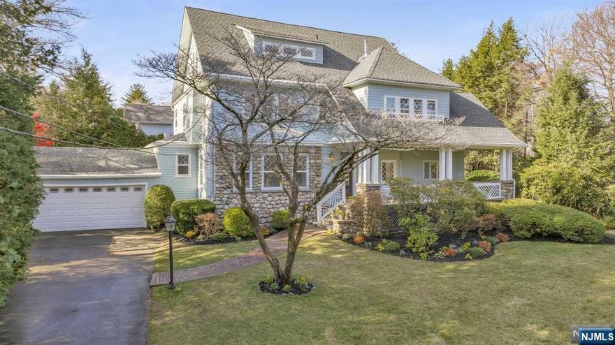 Situated in the desirable Old Country Club area of Ridgewood, this elegant 6-bedroom, 4.5-bath Colonial offers the perfect blend of modern amenities and easy access to NYC transportation and local shops. The inviting lemonade porch sets the tone for this fully renovated home. The kitchen, featuring Thermador appliances, opens to the family room and offers convenient access to both the garage, mudroom & powder room. The expansive living room includes a fireplace, while the dining room boasts newly installed French doors that lead to the backyard. The second floor comprises 4 bedrooms, including a full hall bath with laundry facilities, and a luxurious primary suite complete with a walk-in closet and ensuite bath. The third floor provides two additional bedrooms and a full bath. The finished lower level includes a full bathroom, laundry room, and family room, offering plenty of space. This beautifully renovated home truly has it all!