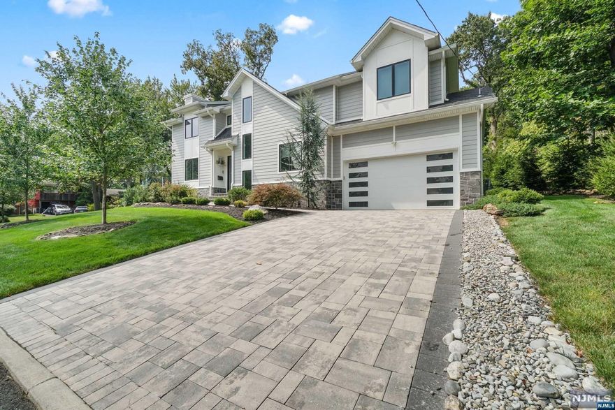 THIS BEAUTIFUL 5 BEDROOM COLONIAL WAS BUILT BY LUMAJ BUILDERS ONLY 5 YEARS AGO AND IS LOCATED ON A QUIET STREET IN CRESSKILL. FIRST FLOOR - ENTRY FOYER, LIVING ROOM WITH FIREPLACE, FORMAL DINING ROOM, EAT-IN KITCHEN, POWDER ROOM AND A MUDROOM LEADING TO THE 2-CAR ATTACHED GARAGE. SECOND FLOOR - PRIMARY BEDROOM SUITE WITH WALK IN CLOSET AND PRIMARY BATH, RADIANT HEATED FLOOR. EN-SUITE BEDROOM, BEDROOM, BEDROOM AND A JACK & JILL BATHROOM. LOWER LEVEL - FINISHED WITH BEDROOM, FULL BATHROOM, WET BAR AND RECREATION AREA. FULL HOUSE GENERATOR, NEST DOOR BELL, CENTRAL VACCUM AND SPEAKERS IN CEILING. OUTDOORS - BEAUTIFUL PRIVATE YARD WITH PATIO. WONDERFUL TOWN, EXCELLENT SCHOOLS AND EASY ACCESS TO NYC!
