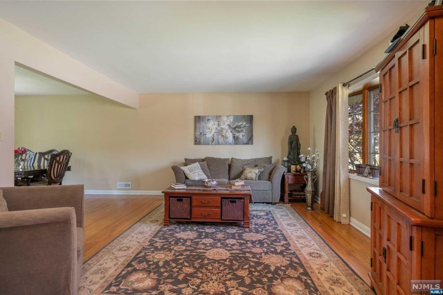 WELCOME HOME!!! Suburban living at its' best. Move into this spacious updated 4 Bedroom, 3.5 Bath Split on over 1/3 of an acre of property in a desirable section of Wayne. This lovely, expanded home will not disappoint. Some of the highlights include kitchen with stainless steel appliances and granite countertops with a large opening right into the dining room. Spacious family room with hardwood flooring completes this level of living. Head upstairs, and you will find 4 bedrooms. The Oasis of a primary bedroom was built in 2017 with a beautiful, attached bathroom offering a large shower, along with a tub and double vanities. 2 Large walk-in closets help compliment the rest of the primary bedroom. There other nice sized bedrooms await, including the original primary bedroom that has an attached full bathroom. The home also features a 2 car garage with an entrance into the home's den featuring a bar along with a large area for a couch and TV. Large yard too!