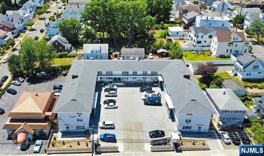 Large apartment complex featuring 25 one-bedroom units (975 sq ft each) on two stories with storage possibilities in basement. Properties includes a large parking lot for 26 cars to accommodate tenants and guests, as well as newly added lighting to the lot. The property has seen several recent upgrades - new paint to the walls and doors and new flooring with washer/dryer and AC split systems in select units, new gym, front and back decks, laundry room (coin operated adds extra income) and bathroom in basement, new roof (3 years old), new electrical boxes, hot water heaters, and fire alarm up to code. Entry and All units are metered separately. Tenants pay all utilities. Located right across from train station and bus stops allowing quick and efficient travel locally within New Jersey and other major cities such as New York and Pennsylvania. This property is the perfect value-add opportunity for savvy investors!