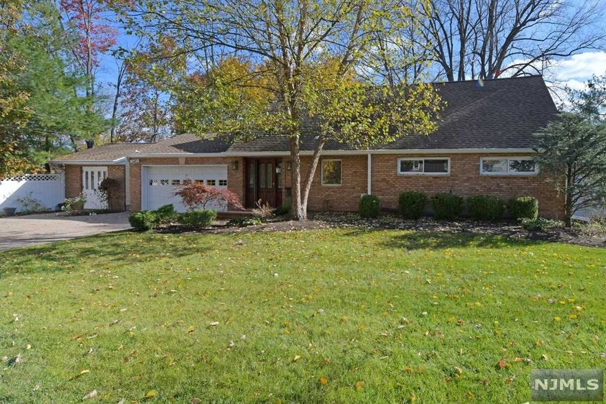 Wonderful location & curb appeal for this brick front expanded and raised ranch. Offering over 2100 sq. ft. with 4/5 bedrooms, 2 full baths, spacious kitchen w/double ovens, pantry cabinets and dining area, formal dining room, family room offers skylights and wood burning stove, a true laundry/mud room, large bonus room great for sunroom or addt'l family room with a 2" sunblock roof (diffuses heat), updated main floor bath offers steam shower. Main floor also consists of primary bedroom and additional bedroom offers custom shelving. 2nd floor offers 3 bedrooms and full bath. Exterior offers beautiful paver driveway and walkway, oversized garage, beautiful brick front shed, spacious patio and yard offers privacy fence. Updates galore ... new boiler, young roof, 3 zone baseboard heat, water softener, central air, generator, security sys, sprinkler system and so much more! Close proximity to transportation (bus & rail), shops, worship & eateries.