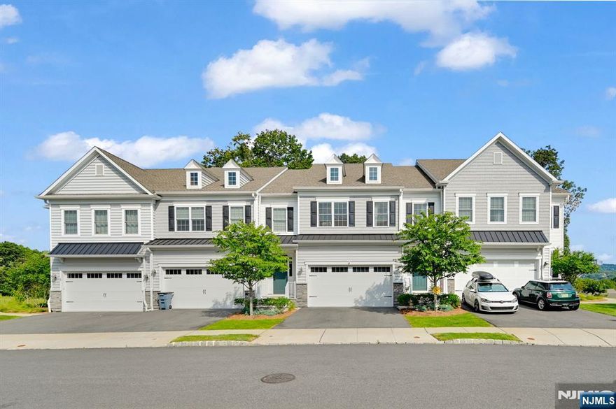 Introducing the sought-after HAVERFORD model on a premium private wooded lot! This stunning townhome offers three levels of luxury living, including a finished walk-out basement with a full bathâ€”ideal for entertaining, relaxing, a guest suite â€“ or all three. Step inside to find modern finishes, high ceilings, an open layout, and wide-plank hardwood-style floors flooded with natural light. The main level features a spacious foyer, living room, a gourmet kitchen with center island, stainless steel appliances, ample cabinetry and a pantry. The dining area opens to a private deck overlooking serene wooded views. A powder room, mudroom with coat/shoe closet, and 2-car garage access complete the level. Upstairs offers a versatile loft, a luxurious primary suite with walk-in closet and spa-inspired bath featuring double sinks, shower, and linen closet. No need to close the blinds â€“ privacy & trees surround!! Two additional spacious bedrooms, a second full bath, and a laundry room round out the floor. The FINISHED WALK-OUT basement includes a 3rd full bath and offers flexible space for a guest suite, gym, family room, home office â€“ or all of the above with walkout access to a private patio and green space. Enjoy resort-style living with a 5,000 sq ft clubhouse, fitness center, infinity pool, and shuttle to Upper Montclair train station. Near Cedar Grove Park and Hilltop trailsâ€”this is luxury, location, and lifestyle combined!