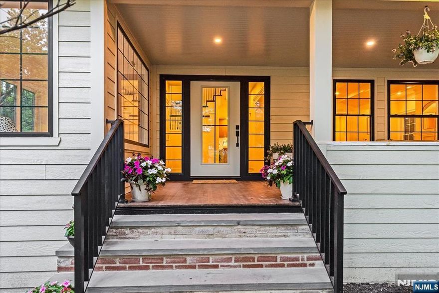 A stunning complete renovation in one of Montclair's most desirable locations! Just minutes to NYC bound train and bus lines, and steps from the vibrant Walnut Street village brimming with boutiques, restaurants, cafes, and Farmers market. Every detail has been thoughtfully reimagined: brand new roof on house and garage, new plumbing, electric, hvac, windows, siding, plus a 2 car garage with electric doors. A gracious open front porch welcomes you into a light-filled home with gorgeous 4 in select white oak floors and a herringbone foyer. The layout offers the best of both worlds: open flow for entertaining and quiet corners for daily life. Custom millwork and designer lighting add architectural interest throughout, while modern conveniences shine- like the first floor mudroom, second floor laundry complete with washer and dryer, wet bar off kitchen and magazine worthy baths.The chef's kitchen features a 48 inch GE Monogram 6 burner range with griddle, farm sink with disposal, pot filler, quartz countertops, generous island with seating for 4 and loaded with storage, seamlessly connected to the great room. The vaulted ceilinged primary suite is a show stopper with 2 walk in closets, floor to ceiling picture window and spa- like bath with soaking tub, water closet and dual vanity. Finished basement adds a rec room, powder rm and 2nd laundry option. Private, beautifully landscaped yard with irrigation, back deck and bluestone patio. This is Montclair living at it's finest!