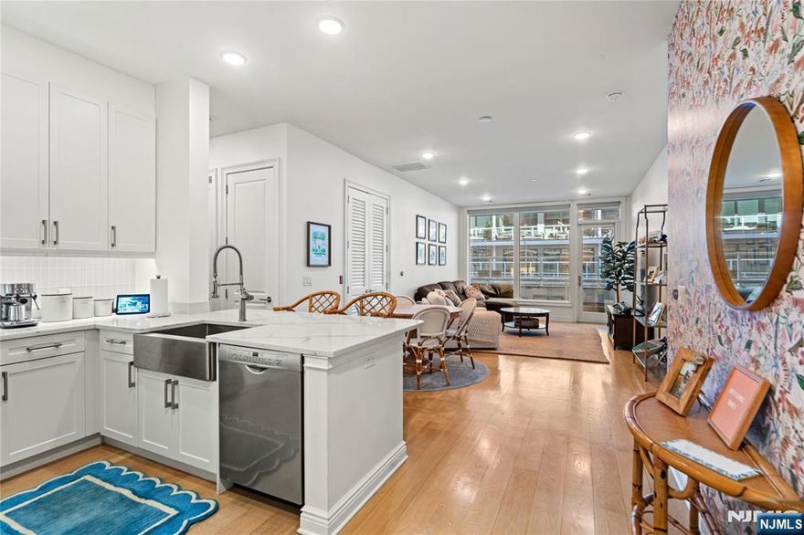 **Call Listing Agent at Keller Williams City Views Realty Office: 201-592-8900**Discover urban sophistication at the Glasshouse in this stunning Northeast-facing 2 Bed/2 Bath residence. Spanning 1,299 sqft w/a 297 sqft balcony, enjoy the breathtaking Hudson River & NYC views. The gourmet kitchen is equipped w/Subzero, Wolf, & Bosch appliances & a breakfast bar, flows seamlessly into the dining & living areas, enhanced by 10ft ceilings & direct access to a private outdoor space. The primary ensuite boasts ample closets & storage and a spa-like bath w/a rain shower, soaking tub, and direct access to your private patio. Additional features include a spacious 2nd bedroom, modern full bath, W/D, Hunter Douglas remote window shades in the living & primary bedroom, 2 indoor parking, and 1 storage unit. Enjoy Glasshouse amenities like a pool, fitness center, rooftop terrace w/panoramic views, & 24-hour concierge service. Ideally located near transportation, dining, shopping, & entertainment.