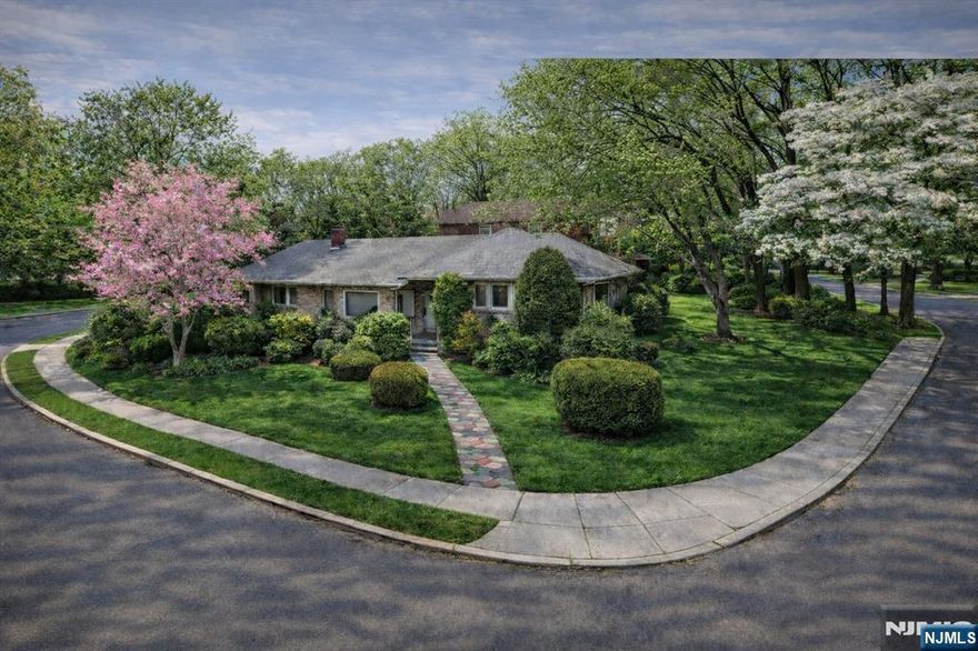 Exceptional opportunity in a prime Teaneck location! This corner property at 633 Wilmerding Ave features an approx. 9000 sq . ft. lot with incredible potential to build your dream home. Township-approved plans are already in place, providing a head start for buyers looking to create a custom residence. The existing home also offers the option to renovate or expand. Situated on a serene, tree-lined property in a desirable neighborhood, this is a rare chance to design the perfect custom home. House is being sold AS IS