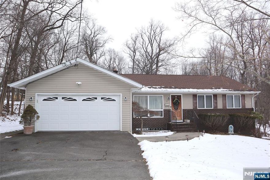 Welcome to this wonderful home located in sought out North Haledon, this home offers the perfect blend of space and comfort. Situated on a beautiful piece of property, this 5-bedroom, 3-full-bath residence lends well to multi-generational living or home office, featuring a ground-level suite complete with its own kitchen, full bath, and 2 bedrooms, as well as a living room, the spacious layout provides both privacy and togetherness. A two-car garage and additional parking for multiple vehicles. Experience the charm and versatility of this exceptional home. plenty of storage, much too much to mention.