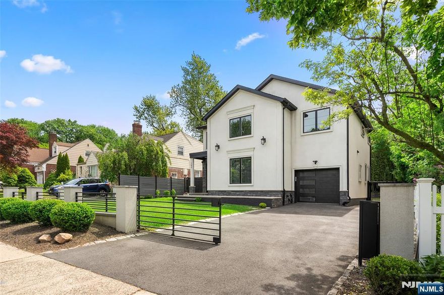 Welcome home to this sleek and modern, beautifully maintained Colonial home located in the vibrant and sought-after community of Leonia. This spacious and versatile property offers a unique combination of timeless charm, functional living space, and valuable zoning flexibility, making it perfect for both residential living and professional use. Set on a generous lot, the home features a modern layout with sunlit rooms, hardwood floors, and classic architectural details that create a warm and inviting atmosphere. A formal living features a gas fireplace leading to a gourmet chef's kitchen with high-end appliances. Find retreat in the breath-taking primary suite with ample closet space, large windows and an en-suite bathroom. Additional three spacious bedrooms along with three full bathrooms all custom designed for aesthetic perfection. Zoned for both residential and office use, it presents an excellent opportunity for professionals looking to establish a home-based business or create a mixed-use environment. The location is unbeatableâ€”just moments from Leoniaâ€™s quaint downtown, filled with shops, restaurants, and parks, and within walking distance to highly rated schools. With quick access to major highways and direct transportation options into New York City, this property offers suburban comfort with urban convenience. Whether youâ€™re looking for a forever home, an investment, or a space to live and work.