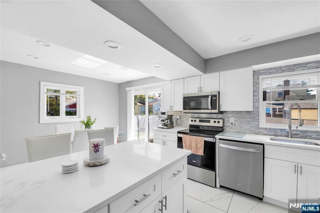 Photo of 136 E Clinton Avenue, Bergenfield, NJ 07621 (MLS # 26012434)