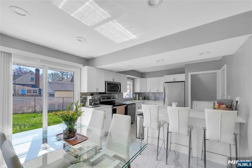 "Step into your very own dream home! This beautifully renovated one-family house in Bergenfield, New Jersey, blends every comfort you desire with elegant style. Imagine endless memories crafted in the gorgeous kitchen, boasting quartz countertops and a big island. Sunshine pours into this space, and just steps away, a sliding door leads to your private patio with pavers, overlooking a lush green yard. Inside, beautiful, refinished hardwood floors run throughout with a few stairs leading you to three good size bedrooms and a gorgeous bathroom. A lower level takes you to, a den or office space and a half a bath. A third level with a laundry area and a family room complete this inviting home. With a one-car garage and parking for an additional four cars, convenience is at your doorstep. Ready to experience your dream home? Contact us for a viewing!"