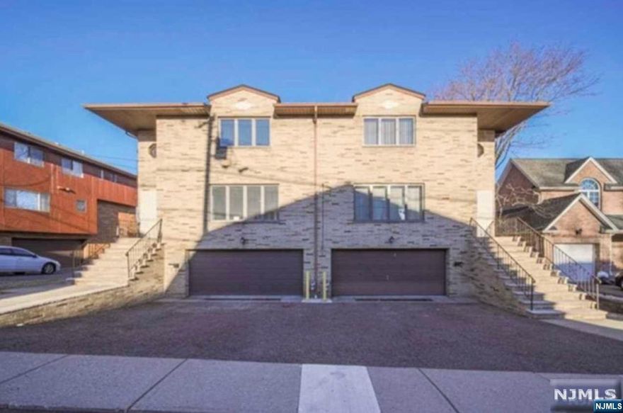 Recently renovated Over sized (75x120) side/side home in a prime location of Fort Lee. Step into the marble step entrance with winding staircase. Brand new modern eat-in kitchens, elegant bathrooms, and hardwood flooring already in place. Location also offers close convenience to NYC transportation, walking distance to school #3,restaurants, shopping, grocery stores, places of worship .Each side has 3Bedrooms and 2.5bathroom ,2car garage with storage room.