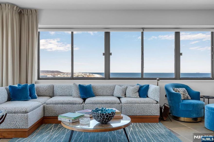 Iconic penthouse where scale, privacy, and oceanfront living welcome the most discerning buyer. Space, style, and sophistication define this extraordinary, one-of-a-kind oceanfront penthouse, spanning approximately 3,100 sq. ft. with two expansive wrap-around terraces. A remarkable home with breathtaking views of the Atlantic Ocean, Manhattan, and the Shrewsbury River. This massive four-bedroom, four-bath masterpiece offers seamless indoor and outdoor living for grand entertaining year-round. Key features include slate, hardwood, and porcelain flooring; a designer eat-in kitchen with top-of-the-line appliances; recessed lighting; a built-in stereo system; cedar closets; luxurious matching baths; and much more.