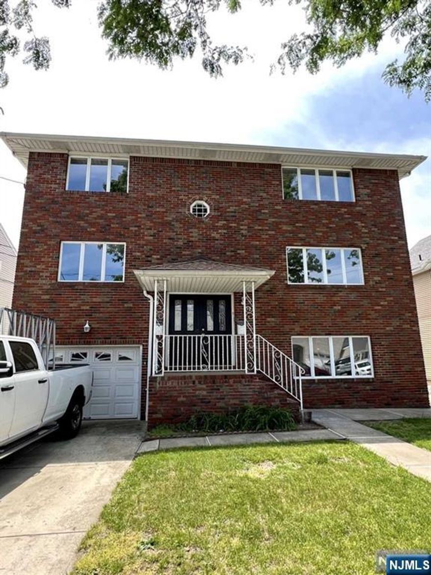 52 Liberty Street features two spacious units. Each unit boasts three bedrooms, two bathrooms, a fully renovated kitchen/dining area, and a comfortable living room. The renovations include new electric and plumbing, modern finishes, central air conditioning, and stacked washer and dryer units. The property also includes a driveway, a one-car garage with plenty of storage space, a pleasant yard, and ample off-street parking. There is also a third unit on the ground floor that can boast as a mother-daughter suite. It has a separate entrance.