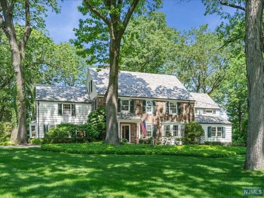 Ideally located on one of Essex Fells' most desired streets, this gracious Colonial offers the flawless combination of timeless elegance and comfortable living sought by today's buyers. The home boasts plenty of curb appeal w/ a sweeping front lawn, circular driveway and exceptional grounds that feature 2 patios, an English garden, mature trees and specimen plantings. Interior highlights include grand formal living and dining rooms, lovely sun room, spacious eat-in-kitchen w/ breakfast area that opens to family room and a home office w/ separate entrance. The Master Suite is complete with en-suite bath, dressing room w/ walk in closet and large sitting room. Finished lower level w/ recreation and game rooms. Essex Fells is an idyllic hamlet w/ excellent schools, extraordinary natural beauty and small town charm w/ an easy commute to NYC