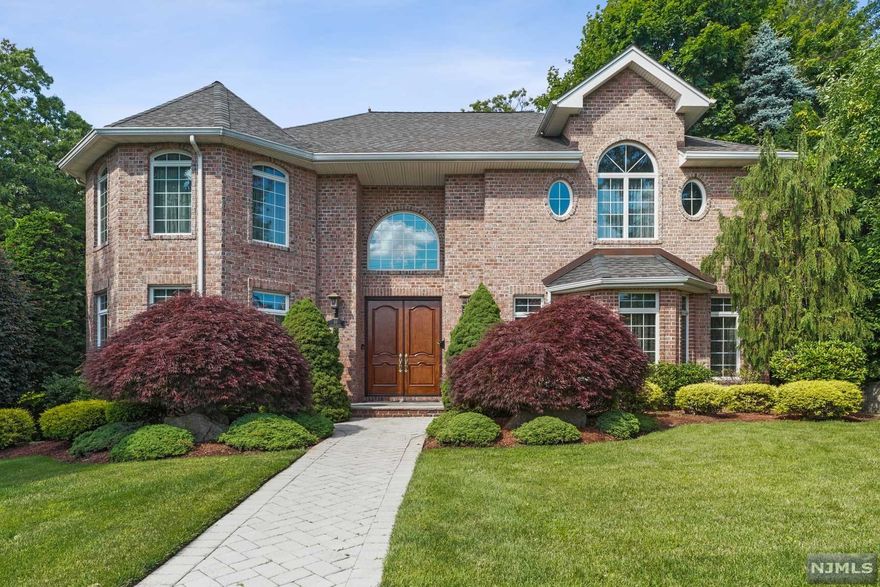 ALL BRICK QUALITY BUILT COLONIAL IN ENGLEWOOD CLIFFS. MOVE IN READY WITH LARGE ROOMS. ENTER THROUGH BEAUTIFUL WOODEN DOUBLE DOORS TO A WONDERFUL ENTRY FOYER, LV, LG DINING ROOM, POWDER ROOM. LG FAMILY ROOM WITH FIREPLACE, BAR AND FRENCH DOORS TO BACKYARD. SPACIOUS MODERN EAT-IN KITCHEN ALSO WITH FRENCH DOORS TO BACKYARD, PANTRY CLOSET AND BUTLER'S PANTRY TO DINING ROOM COMPLETE THIS WONDERFUL FIRST FLOOR. SECOND FLOOR CONSISTS OF MASTER SUITE WITH 2 WICS, MAKEUP AREA AND FULL MASTER BATH. BEDROOM SUITE WITH FULL BATH AND WIC, 2 BEDROOMS, FULL BATH AND LAUNDRY FINISH THIS BEAUTIFUL SECOND FLOOR. BASEMENT HAS ENTRANCE FROM A 3 SEPARATE CAR GARAGE, 2ND LAUNDRY, FAMILY ROOM, BEDROOM, FULL BATH AND LOTS OF STORAGE SPACE. SURROUND SOUND ALL ON FIRST FLOOR. WOOD FLOORS THRU OUT. SECURITY SYSTEM. DO NOT MISS THIS PICTURE PERFECT HOME!