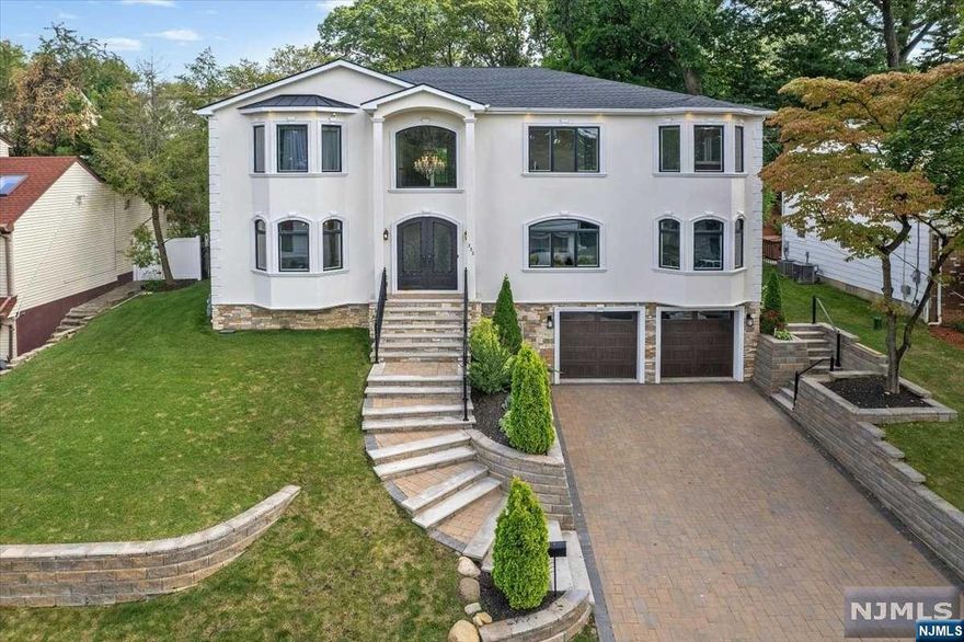 Stunning recently developed new construction is situated in desirable Paramus. Approx. 6,500 SF across all 3-levels, complete with custom trim work. 1st fl showcases a grand two-story entrance foyer, a two story family rm, a kitchen equip. with high-end appl, custom cabinetry, walk-in pantry, a bedrm, full bthr/office/powder room, with heated fls throughout the house. 2nd fl you'll find the primary suite with two walk-in closets, along with three additional bedrms and two full bthr. Primary bthr includes a dbl vanity, a soaking tub, glass shower. Basmnt is finished with radiant heat and offers a media room, a gym, and a recreation rm with a full bath. The home is equipped with security cameras, a central vac system, sprnkls, a fenced backyard. Backyard is a private oasis, an inground heated pool, a built-in kitchen (gas-connected), complete with a sink and a mini-refrigerator and a built-in shed w.TV. Close to schools (MS bus pick-up on the same block), parks, shop, and NYC trans.