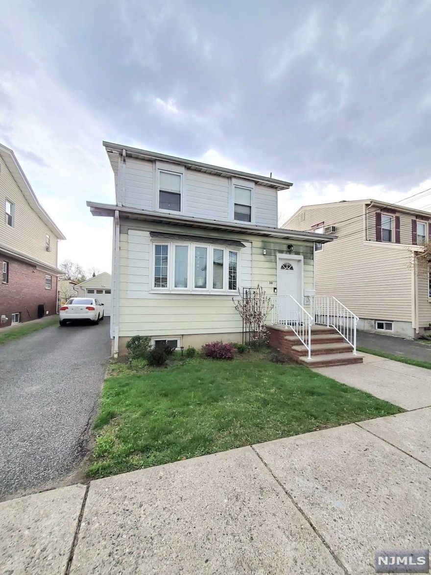 This is a 2 Family house on a quiet street, within walking distance to town and public transportation on a large lot with 1 car garage and 3 car length driveway. 3 bedrooms, 2 baths total. Central Air in each unit and Laundry hook ups in the basement. Nicely manicured lawn and separate storage units for the tenants.