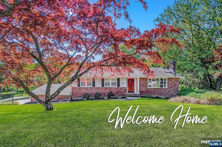 Welcome to 449 Rifle Camp Road - a Seamless Blend of Comfort, Style, and Nature. Framed on a beautifully landscaped oversized lot that backs directly to the serenity of Rifle Camp Park, this thoughtfully curated raised ranch offers more than just a place to live; it delivers a lifestyle. Designed by a professional interior decorator, this 3 bedroom, 2.5 bath home is the perfect fusion of modern finishes and vintage charm. The sun-filled main level features a spacious living and dining area, a stylish kitchen with timeless appeal, and a private primary suite complete with its own full bathroom. The walkout lower level is an entertainerâ€™s dream; offering a full kitchen, cozy fireplace lounge, office/studio and bath, all flowing effortlessly to your backyard sanctuary. Whether hosting guests or enjoying peaceful mornings alone, the lush gardens, mature trees, and expansive patio create the ultimate personal retreat. With refined details throughout and a location that feels like a private escape yet remains close to everything, 449 Rifle Camp Road is more than a home, itâ€™s your haven.