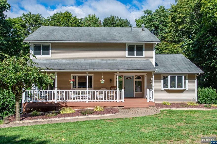 This sunny four bedroom colonial is the one you have been waiting for! The peaceful front porch welcomes you into this beautiful home on a quiet cul de sac. The view of the wooded area across the street provides privacy and even access to hiking trails. The living room is bright and spacious and opens to the dining room. The first floor also boasts an eat in kitchen with granite countertops and stainless steel appliances, front to back great room, laundry and a half bath. The back deck and three season room allow you to enjoy the outdoors once again from this level. Upstairs you will find the primary bedroom with full bath along with three additional ample sized bedrooms and the main bath. The finished walk out basement leads to a covered patio and private backyard oasis as well as a large storage room and the two car garage. A perfect place to call home!