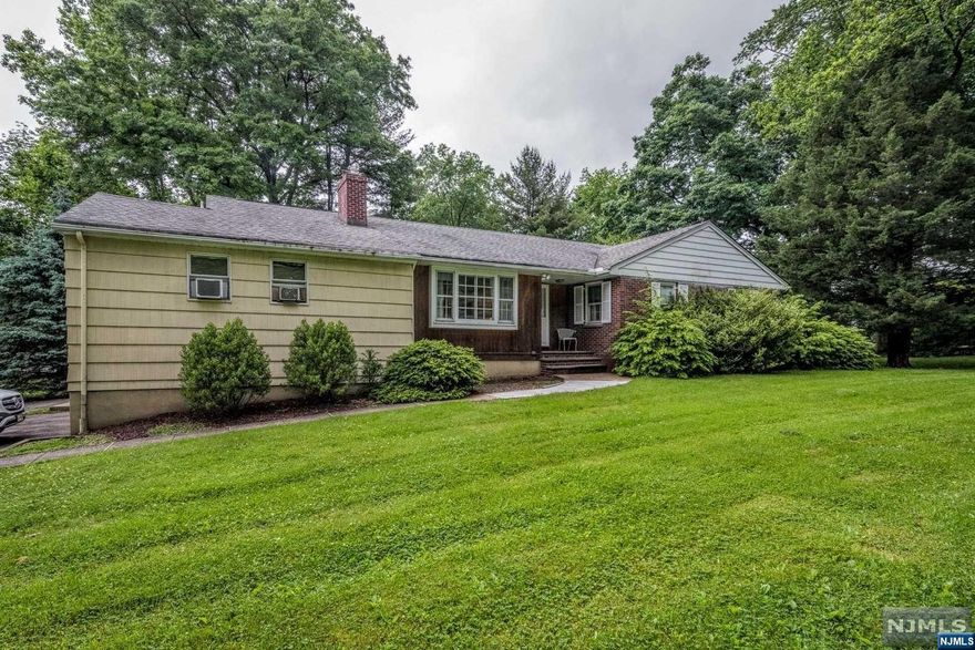 Fabulous opportunity to live in one of Bergen County's most sought after communities! Welcome to Woodcliff Lake, which offers outstanding schools and recreational programs. This lovely home is steps from the beautiful town swim club. Enter the foyer which leads to the warm, inviting living room with gas fireplace where you can spend winter evenings. Spacious dining room with room for everyone. Enjoy holidays with family and friends. Generously sized kitchen. Large sunroom. Primary suite with updated bath. Two guest bedrooms and full hall bath. Deck overlooking large backyard. Huge basement with high ceilings waiting to be finished. Guest suite with private entrance above garage includes kitchenette, bedroom, small bedroom and small living room. Perfect for extended family.