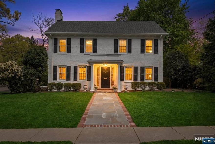 Move right into this beautifully newly renovated four-bedroom, four-bath brick Colonial that blends timeless charm with modern living. Set on a quiet, tree-lined street in one of Tenaflyâ€™s most desirable neighborhoods, this home offers the perfect retreat just minutes from New York City. Sun-filled interiors and gleaming hardwood floors create a bright, airy feel throughout, while thoughtfully designed living spaces provide an effortless flow for both everyday living and entertaining. A gracious entry foyer welcomes you into a spacious living room with a gas fireplace, an oversized dining room ideal for hosting, and a sleek, updated kitchen featuring quartz countertops and stainless steel appliances. The adjoining family room and a stylish new powder room complete the main level. Upstairs, the serene primary suite offers a walk-in closet and a newly renovated spa-like bath. Three additional generously sized bedrooms and a full hall bath provide ample space for family or guests. The finished basement adds valuable living space with a recreation room, laundry area, and an additional powder room. Outside, enjoy a beautifully landscaped, fully fenced property with a large bluestone patioâ€”perfect for relaxing or entertaining. All this, just six miles from NYC, offering the ideal balance of suburban tranquility and city convenience.