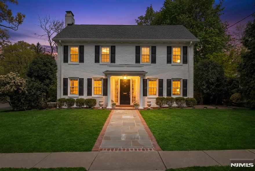 Move right into this beautifully newly renovated four-bedroom, four-bath brick Colonial that blends timeless charm with modern living. Set on a quiet, tree-lined street in one of Tenaflyâ€™s most desirable neighborhoods, this home offers the perfect retreat just minutes from New York City. Sun-filled interiors and gleaming hardwood floors create a bright, airy feel throughout, while thoughtfully designed living spaces provide an effortless flow for both everyday living and entertaining. A gracious entry foyer welcomes you into a spacious living room with a gas fireplace, an oversized dining room ideal for hosting, and a sleek, updated kitchen featuring quartz countertops and stainless steel appliances. The adjoining family room and a stylish new powder room complete the main level. Upstairs, the serene primary suite offers a walk-in closet and a newly renovated spa-like bath. Three additional generously sized bedrooms and a full hall bath provide ample space for family or guests. The finished basement adds valuable living space with a recreation room, laundry area, and an additional powder room. Outside, enjoy a beautifully landscaped, fully fenced property with a large bluestone patioâ€”perfect for relaxing or entertaining. All this, just six miles from NYC, offering the ideal balance of suburban tranquility and city convenience.