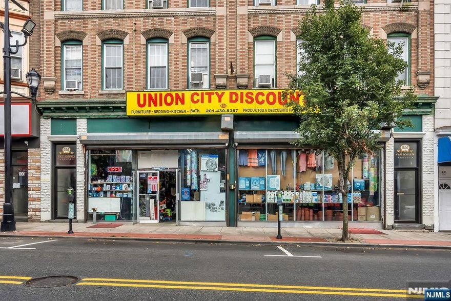 Commercial Mixed-Use. Prime Investment Opportunity in Union City. Eight residential units plus a commercial retail store that can be used as two stores in the future as building is 100% occupied. The retail space has high ceilings and includes a full basement, providing additional storage or functional space. Tenants pay seperate utilities: electric, heat, hot water and cooking gas.. Inquire for full details on income and expenses. Great income with upside potential. Lot size 50x108. Located in a highly desirable area with heavy foot traffic.