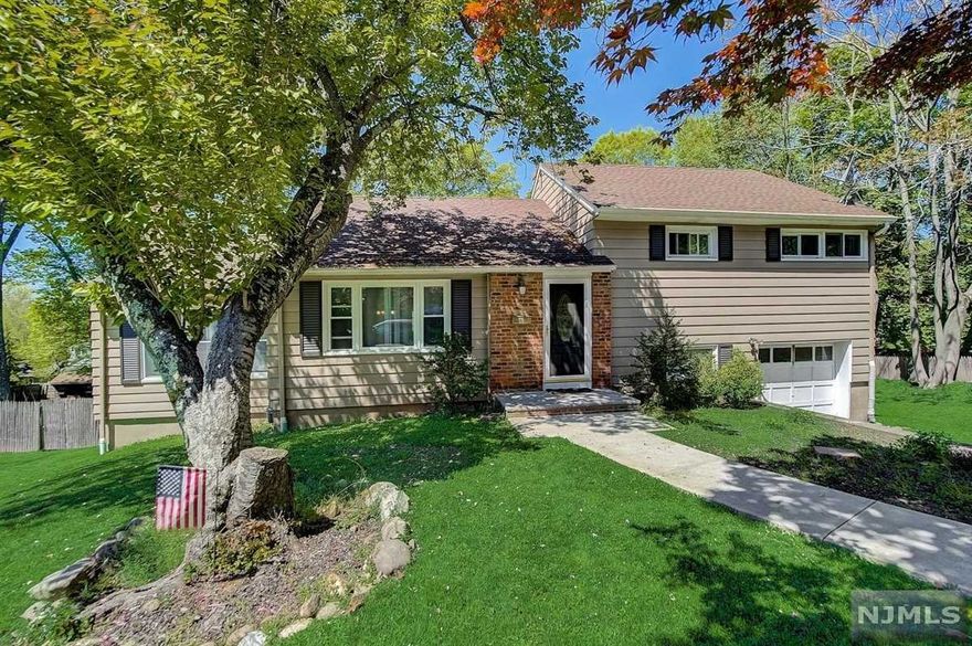 Absolutely beautiful! You'll feel right at home as soon as you walk into the immensely appealing 3 bedroom home. Entry foyer, light & bright kitchen, spacious living room, formal dining room with access to your private yard. Palatial lot offering plenty of space to enjoy endless outdoor entertainment possibilities. Next you'll experience the cozy family room illuminated by natural light and framed by a gorgeous fireplace. Second level primary suite, main bath and 2 additional ample sized bedrooms. Hardwood floors throughout and pull down attic storage. Outstanding location, great schools shopping & easy access to Montvale train station. This is the one, stop by fall in love!