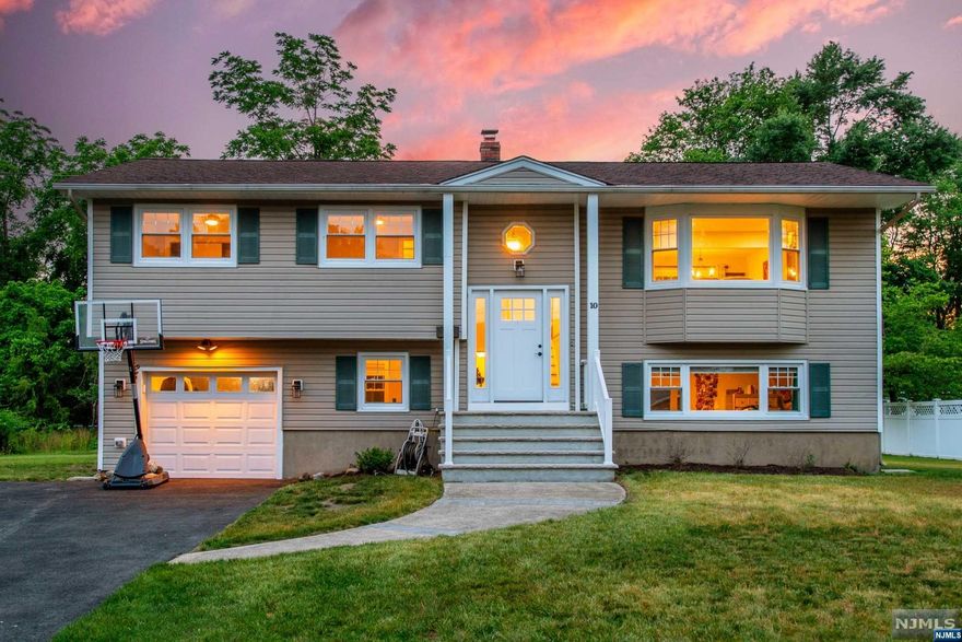 Welcome home! Located Just steps away from Pequannock's favorite Greenview park, is this turn key, 4 bedroom plus bonus room, 2 1/2 bath updated home! 10 Robert pl features bright and airy spacious rooms, hardwood floors throughout, fully renovated kitchen/ bathrooms, and a walkout basement with in law potential. Top it off with a generously sized yard, this is the one you don't want to get away!! NOT located in a flood zone and in a desirable section of Pequannock, who wouldn't want to be steps away from tennis courts, parks, schools and sports fields! Pequannock is also home to Sunset Valley golf course, Chilton Hospital, an abundance of local businesses, and minutes drive to major highways. ** Pequannock has went through a tax assessment please inquire with town.