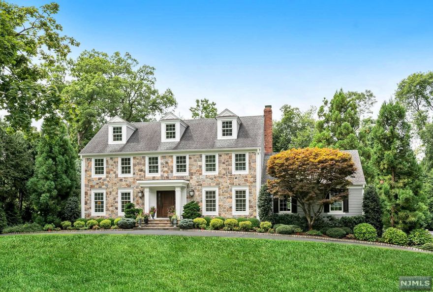 As you travel up the circular drive, be prepared to be swept away by the charm and beauty of this spectacular storybook home. This classic center hall colonial draws you in at every turn. Enter the home through the generous EF and glance into either the lovely formal LR or the beautiful sun drenched DR w custom moldings. The gourmet kitchen w top of the line appliances, high quality cabinetry, center island and Cesarstone countertops opens up to the family room w vaulted ceilings, gas FPL and sliding doors leading to patio. You will also find a fabulous newer full bath, additional bedroom/bonus room w laundry all on first floor. The 2nd floor has 4 bedrooms, which includes a gorgeous master suite w walk in closet/gleaming master bath w soaking tub, and an additional hallway bath. The lower level has a full kitchen, Rec room/sitting room, BR and full bath. Walk out to the pool, and impeccably landscaped rear yard. This home is meant to impress the most discerning buyer!