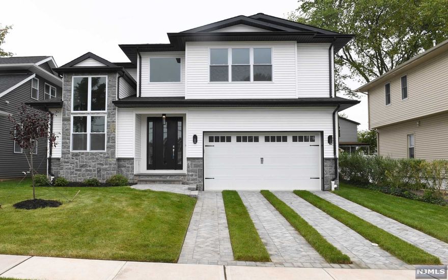 Brand new construction for an amazingly affordable price in one of the most desired areas in Bergenfield. True luxury, Beautiful new construction, exceptional quality finishes throughout, made to perfection by one of Tenafly's premier builders. Entertainer's dream. A spacious open floor plan which includes 5 bedrooms, 4.5 baths including full finished basement and 2 attached car garages, with a great private backyard. The first floor includes an eat-in kitchen a big island, quartz countertops, and stainless steel appliances, open to the family room and fireplace. Also included the living room, dining room, powder, and mud room. Exit to the backyard. The second floor includes a total of 4 bedrooms combined of 3 bathrooms. Master bedroom w/Master bath and freestanding tub, en-suite, and 2 more bedrooms. The laundry room is located conveniently on the 2nd floor. The basement includes a recreation area, a bedroom, and a full bathroom. Must see.