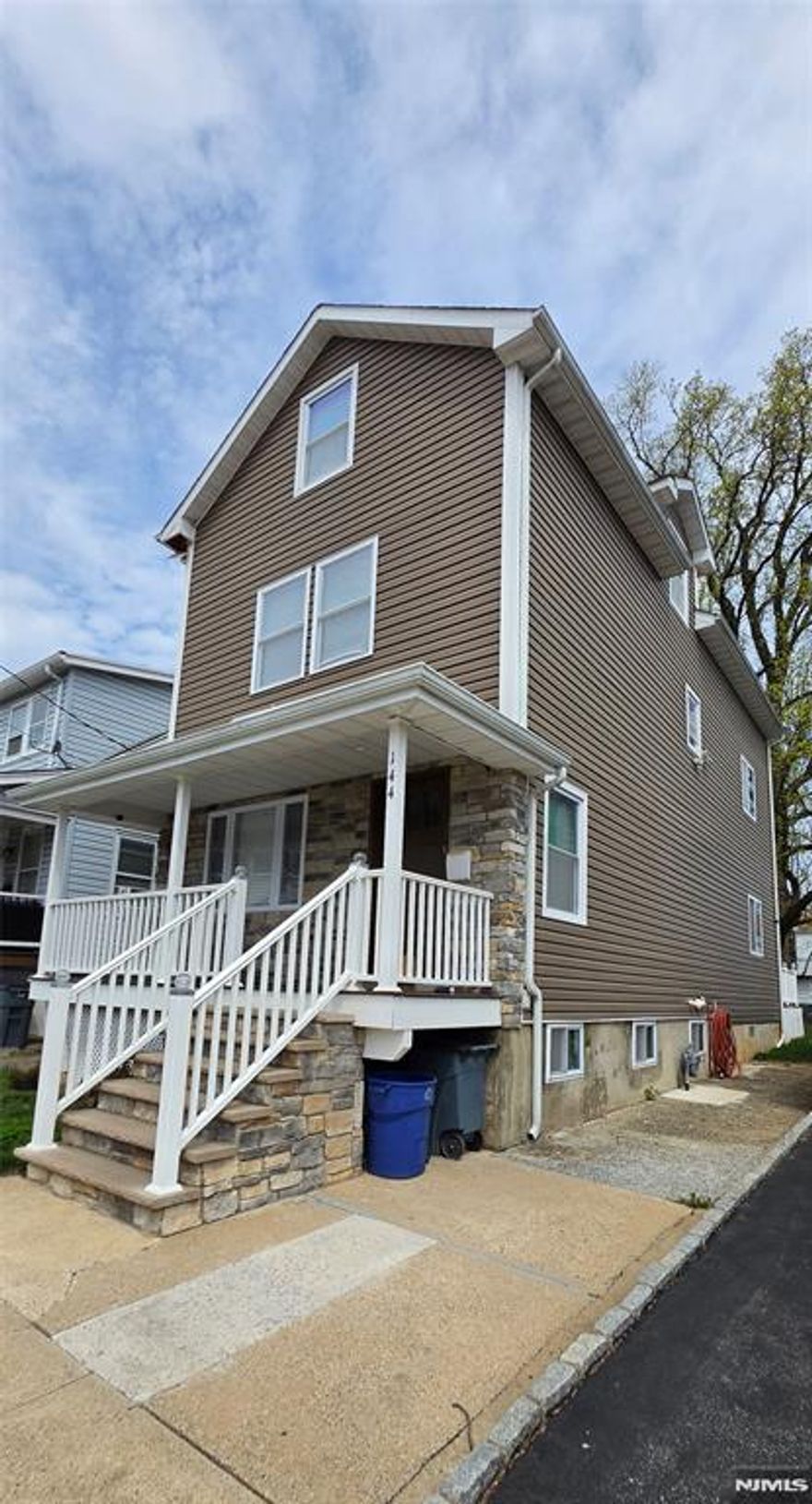 Come see this beautiful well-maintained Single-Family Colonial style with an open first-floor layout. Spacious living and dining room with gleaming hardwood floors. Updated kitchen with stainless steel appliances, granite countertops, powder room, and laundry area. The second floor offers an oversized primary bedroom with walk-in closet and private balcony, plus a spacious second bedroom and full bath. The renovated third floor includes a bright additional bedroom, and bonus office space with high ceilings. Finished lower level with marble floors and half bath. Sliding doors lead to a deck and private backyard perfect for relaxing or entertaining. Meticulously maintained and ready to move in.