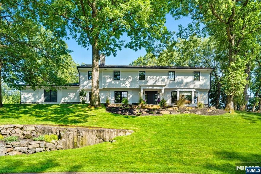 Exceptional fully renovated 5-bedroom, 6.5-bath East Hill estate set on a full builderâ€™s acre at the end of a private cul-de-sac. A new circular driveway leads to a striking interior designed by a top professional, featuring Venetian plaster walls, custom millwork, Lutron lighting, Andersen windows/doors, and California Closets. The chefâ€™s kitchen stuns with radiant heated floors, Wolf range, dual Sub-Zero refrigerators, two Bosch dishwashers, double sinks, and an oversized island with pass-through window and bar seating to the patio. The spa-like primary suite is joined by two en-suites with radiant floors, third bedroom and hallway bath. A finished lower level offers full kitchen, surround sound, and walkout. Resort-style grounds include expansive stone and covered patios, fire pit, Lynx grill, outdoor kitchen, hot tub, basketball court, putting green, and more. Modern systems include new HVAC, Generac generator, and CCTV. Luxury, privacy and low taxes complete this rare East Hill offering.