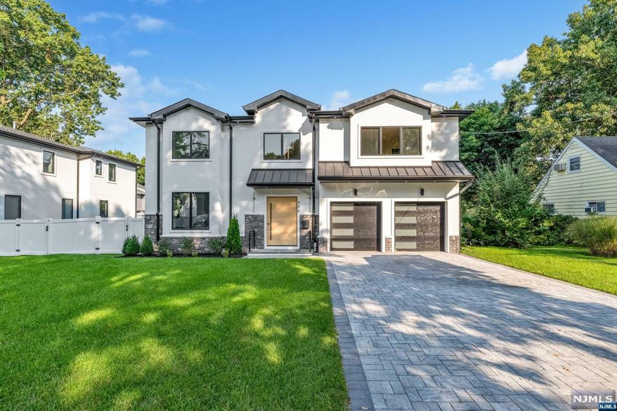 Experience luxury living in this brand-new, modern construction home on the desirable East Side of Paramus! With over 6,000 sq ft of living space, this stunning residence offers 6 bedrooms and 5.5 bathrooms. Enter through the grand 2-story foyer, leading to open-concept Living & Dining rooms and a soaring 2-story Great Room, all enhanced by intricate moldings and elegant lighting. The designer kitchen boasts Quartz countertops, Sub-Zero & Wolf appliances, and a large waterfall island. The main level includes a bedroom with en-suite bath, a mudroom, half bath, and access to a spacious deck. Upstairs, the luxurious Primary Suite features a huge walk-in closet and spa-like bath, plus 3 additional guest bedrooms and a convenient 2nd-floor laundry room. The fully finished basement offers a home theater, wet bar, bedroom, full bath, and rec space. Enjoy outdoor entertaining on the oversized deck and fenced backyard. Paramus offers top-rated schools, shopping, and easy highway access.