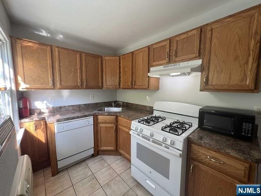 Spacious updated 1st floor apartment in prime location. Features 2 BD, LR/DR combo, kitchen & 2 full baths. Plenty of closet space. 2 off-street parking spots. Wood floors. No laundry. .7 miles to Bay Street Train Station. Close to shopping, restaurants, library. Pets allowed with restrictions. Must call for details. LL has own application process